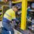 A compressed air service technician services a compressor in Perth, ready for summer